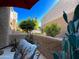 Outdoor patio with patio table, chairs, and lush greenery at 4554 E Paradise Village N Pkwy # 133, Phoenix, AZ 85032