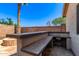 Outdoor kitchen with firepit and bar offers many entertainment opportunities at 4731 N 86Th Dr, Phoenix, AZ 85037