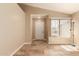 Inviting foyer with tile flooring, a neutral color scheme, natural light and an entry door with decorative glass at 4731 N 86Th Dr, Phoenix, AZ 85037