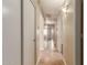 Hallway featuring a neutral color scheme, tile flooring, recessed lighting and white doors to bedrooms and bathrooms at 4731 N 86Th Dr, Phoenix, AZ 85037