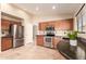 Modern kitchen featuring stainless steel appliances and granite countertops at 4731 N 86Th Dr, Phoenix, AZ 85037