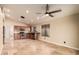 Bright kitchen with stainless steel appliances, wooden cabinets, tile flooring, and a window overlooking the yard at 4731 N 86Th Dr, Phoenix, AZ 85037