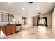 Spacious kitchen featuring stainless steel appliances, wood cabinets, a sink beneath a window, and tile flooring at 4731 N 86Th Dr, Phoenix, AZ 85037