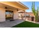 Inviting covered patio with built-in barbecue area and artificial turf at 4731 N 86Th Dr, Phoenix, AZ 85037
