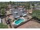 Aerial view of home featuring a private pool, covered patio, and landscaped backyard in a desirable neighborhood at 4812 W Butler Dr, Chandler, AZ 85226