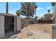 Open backyard with a storage shed, landscaping, and a block wall for added privacy at 4812 W Butler Dr, Chandler, AZ 85226
