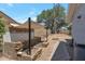 Private backyard with a stone BBQ, shade sail, and a walkway at 4812 W Butler Dr, Chandler, AZ 85226