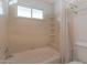Bathroom features a tub with shower curtain and small window at 4812 W Butler Dr, Chandler, AZ 85226