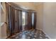 Well-lit dining area with neutral color palette, tiled floor, and a large window with attractive curtains at 4812 W Butler Dr, Chandler, AZ 85226