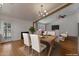 Well-lit dining room with modern chandelier and a seamless flow from the kitchen at 4812 W Butler Dr, Chandler, AZ 85226