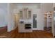 This kitchen features a wine rack, granite countertop, stainless steel oven, sink, and access to 2 other rooms at 4812 W Butler Dr, Chandler, AZ 85226