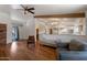 Spacious living room with hardwood floors and an open view to the adjacent kitchen at 4812 W Butler Dr, Chandler, AZ 85226