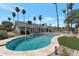 Sparkling pool surrounded by lush landscaping, palm trees, and manicured green spaces at 4812 W Butler Dr, Chandler, AZ 85226