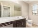 Bathroom with a large vanity, modern sink, and tile flooring at 503 N Ranger Trl, Gilbert, AZ 85234