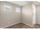 Empty bedroom with two windows and neutral color palette at 503 N Ranger Trl, Gilbert, AZ 85234