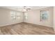 Spacious bedroom with multiple windows and ceiling fan at 503 N Ranger Trl, Gilbert, AZ 85234