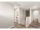 Hallway leading to laundry area with washer and dryer at 503 N Ranger Trl, Gilbert, AZ 85234