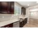 Kitchen boasting dark cabinets, light countertops, and a stainless steel sink at 503 N Ranger Trl, Gilbert, AZ 85234