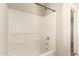 Bright bathtub and shower combo with white tile surround and chrome fixtures at 503 N Ranger Trl, Gilbert, AZ 85234