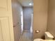 Bathroom with a tile floor, a toilet, and a partial view of a shower and door to the outside at 5323 W North Ln, Glendale, AZ 85302