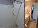 A full bathroom featuring a shower-tub combo, a toilet, and a vanity with a countertop sink at 5323 W North Ln, Glendale, AZ 85302