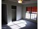 Bedroom with closet and large window at 5323 W North Ln, Glendale, AZ 85302