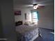 This cozy bedroom features a large window and love seat at 5323 W North Ln, Glendale, AZ 85302