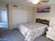 Bright bedroom featuring a ceiling fan and double closet at 5323 W North Ln, Glendale, AZ 85302