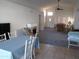 Bright living room with vaulted ceilings, fireplace, and views of dining room and entryway at 5323 W North Ln, Glendale, AZ 85302