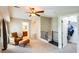 An extra room with a cozy chair, glass block accent and a view of the bathroom at 5734 S 21St Pl, Phoenix, AZ 85040