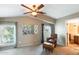 A cozy bedroom area with a comfortable armchair and a large set of windows at 5734 S 21St Pl, Phoenix, AZ 85040