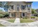 Charming two-story home featuring blue shutters and a stone facade, set amidst a neatly landscaped front yard at 5734 S 21St Pl, Phoenix, AZ 85040