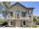 Charming two-story home with stone accents and stylish blue shutters on a sunny day at 5734 S 21St Pl, Phoenix, AZ 85040