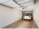 Clean, organized garage with ample space for parking and storage, with a white car parked inside at 5734 S 21St Pl, Phoenix, AZ 85040