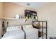 Practical laundry area featuring a washer, dryer, shelving, and storage space for household essentials at 5734 S 21St Pl, Phoenix, AZ 85040