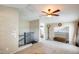 Spacious upstairs area with seating, leading to a walk-in closet and bathroom at 5734 S 21St Pl, Phoenix, AZ 85040