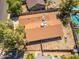 Captured aerially, the house features a spacious backyard, bordered by other homes and neighborhood greenery at 6015 W Acoma Dr, Glendale, AZ 85306