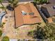 An aerial shot displays a residential house with a backyard surrounded by privacy fencing and sparse landscaping at 6015 W Acoma Dr, Glendale, AZ 85306