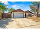 Charming single-story home featuring an attached garage and a large driveway at 6015 W Acoma Dr, Glendale, AZ 85306
