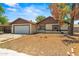 Charming single-story home featuring an attached garage and a low maintenance front yard at 6015 W Acoma Dr, Glendale, AZ 85306