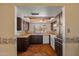 Kitchen view showcasing wooden cabinets, countertops, and wood patterned flooring at 6015 W Acoma Dr, Glendale, AZ 85306