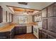 Kitchen view featuring wooden cabinets, countertops, and vintage style design at 6015 W Acoma Dr, Glendale, AZ 85306