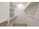 Walk-in closet with custom wood and white shelving and carpeted floor at 6029 E Palm St, Mesa, AZ 85215