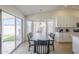 Bright dining area featuring a modern table, chairs, and a view of the outdoors at 6029 E Palm St, Mesa, AZ 85215
