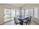 Bright dining area featuring a modern table set and sliding doors to a landscaped backyard at 6029 E Palm St, Mesa, AZ 85215