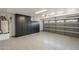 Garage with epoxy floors, built-in cabinets, and an automatic garage door at 6029 E Palm St, Mesa, AZ 85215