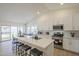 Open concept kitchen with island and breakfast bar, seamlessly connecting to the dining area at 6029 E Palm St, Mesa, AZ 85215