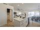 Open layout featuring the kitchen island, living room, and dining area, perfect for entertaining guests at 6029 E Palm St, Mesa, AZ 85215
