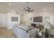 Bright and airy living room with ceiling fan, comfortable seating, and neutral decor at 6029 E Palm St, Mesa, AZ 85215