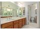 Bathroom featuring double sinks, a big mirror, and tiled floors at 609 E Mesquite Cir # D133, Tempe, AZ 85288